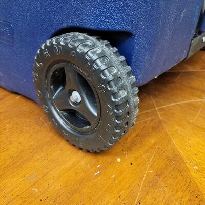 :1 Coleman Blue cooler, white lid on wheels;