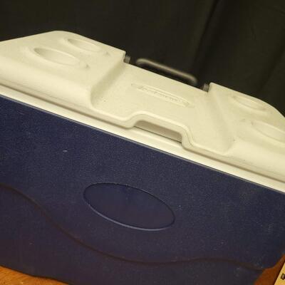 :1 Coleman Blue cooler, white lid on wheels;