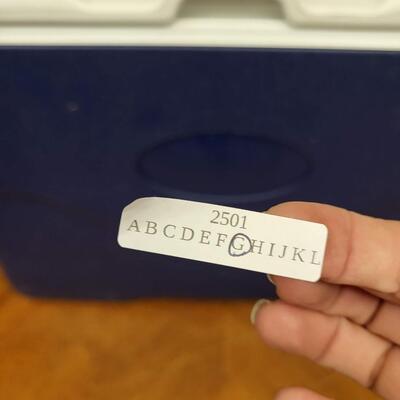 :1 Coleman Blue cooler, white lid on wheels;