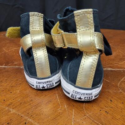 Shoes:1 Converse Size 3 Black and gold hi top converse;