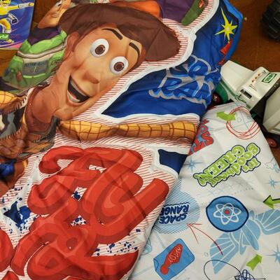 Children:Box Lot Assorted Kids Items: Toy Story TWIN? bedding; Yellow plastic tractor toy; HESS truck;