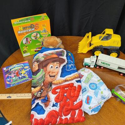 Children:Box Lot Assorted Kids Items: Toy Story TWIN? bedding; Yellow plastic tractor toy; HESS truck;