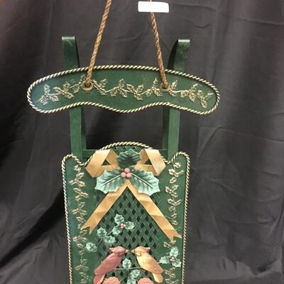 : Green metal decorative sleigh;