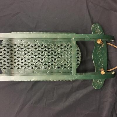 : Green metal decorative sleigh;