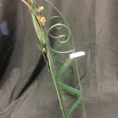 : Green metal decorative sleigh;