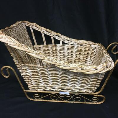 : White wicker and metal sleigh;
