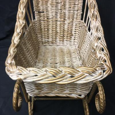 : White wicker and metal sleigh;