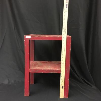 Furniture: Small red table. Plant Stand.;