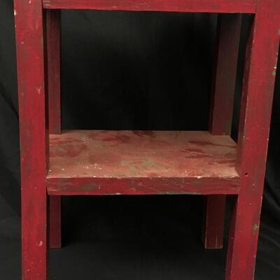 Furniture: Small red table. Plant Stand.;