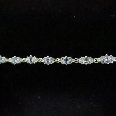 LOT 104  DAINTY 14K BRACELET WITH LIGHT PURPLE STONES