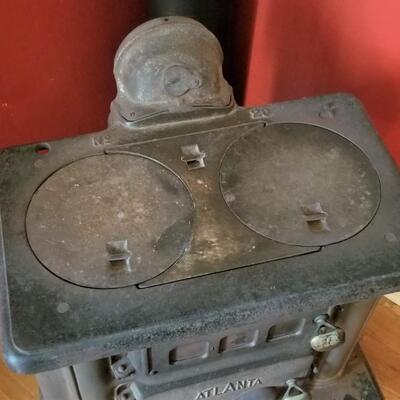 Lot #82  Cool Antique Cast Iron stove with Stack