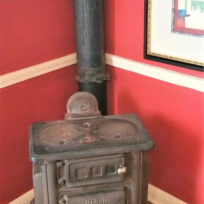 Lot #82  Cool Antique Cast Iron stove with Stack