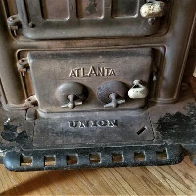 Lot #82  Cool Antique Cast Iron stove with Stack