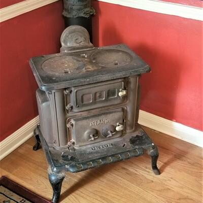 Lot #82  Cool Antique Cast Iron stove with Stack