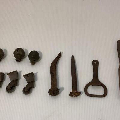 236. 3 Antique Brass Castors, 3  Bells, Oyster Knife,  Railroad Nails & Can Opener