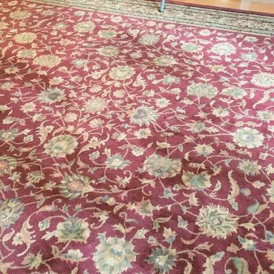 Lot #104 Room Sized Rug with Burgundy tones - traditional styling
