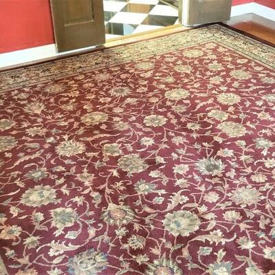 Lot #104 Room Sized Rug with Burgundy tones - traditional styling