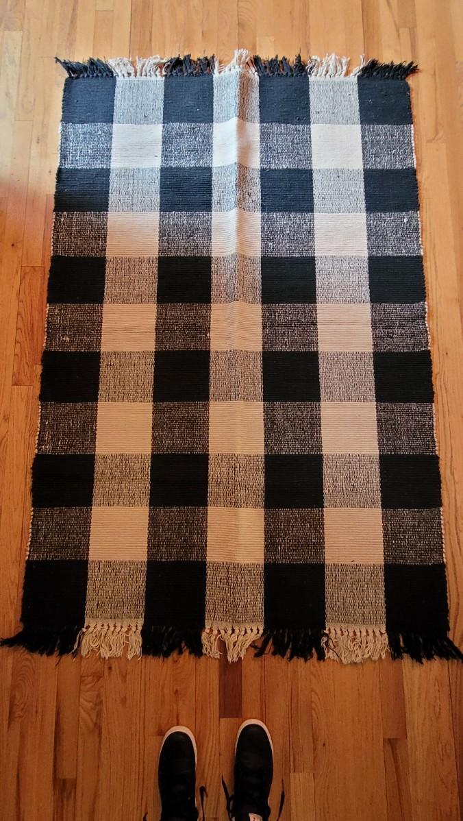 Lot 196: Black and Tan Buffalo Check Woven Rug #2 | EstateSales.org