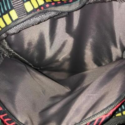 Purses / hangbags: Coleman multi colored bookbag;
