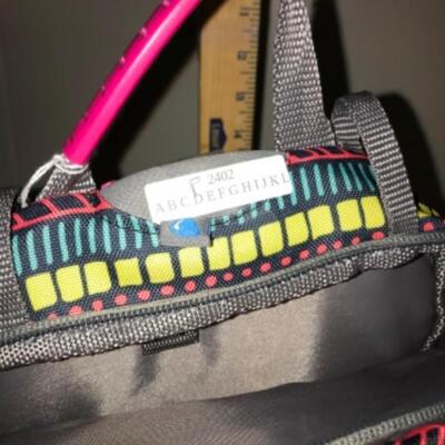 Purses / hangbags: Coleman multi colored bookbag;