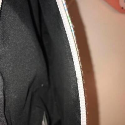 Purses / hangbags: Coleman multi colored bookbag;