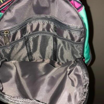 Purses / hangbags: Coleman multi colored bookbag;