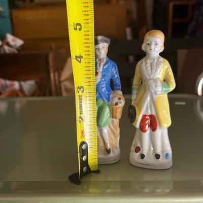 Antique colonial dressed men shaker set