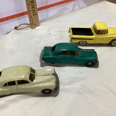 antique cars with metal bases