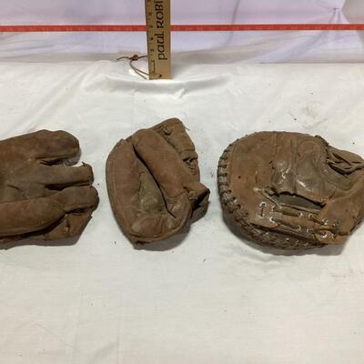 antique baseball mitt and globes