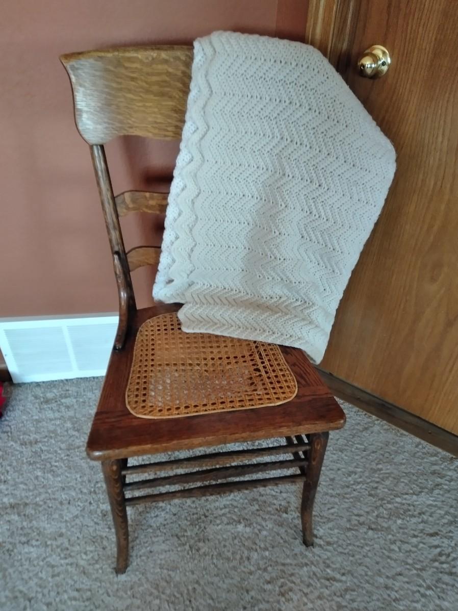 LOT 177 ANTIQUE WICKER SEAT CHAIR WITH AFGHAN (E)