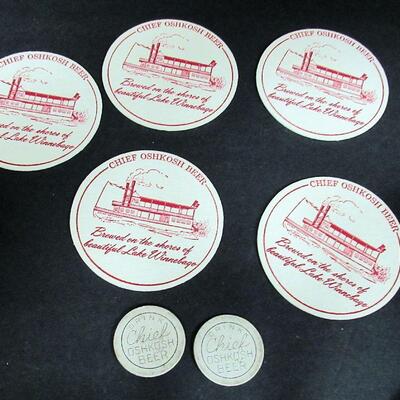 2 Unusual Original Chief Oshkosh Cardboard Tokens and 5 Unused Chief Oshkosh Coasters