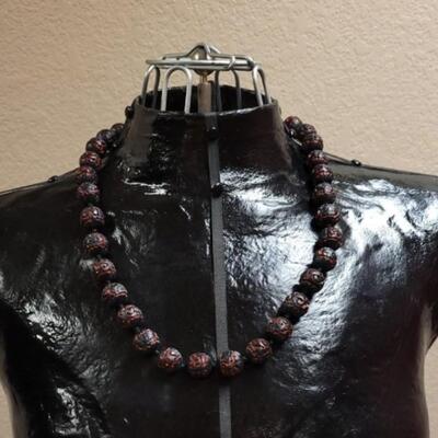 Lot 118: Vintage Chinese Black & Red Carved Cinnabar Necklace