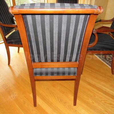 Round pedestal table with four armchairs