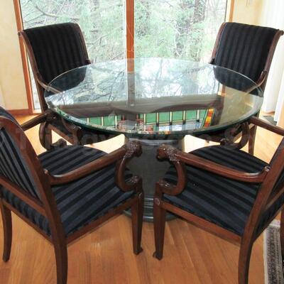 Round pedestal table with four armchairs
