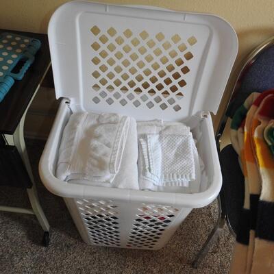 Laundry hamper full of towels