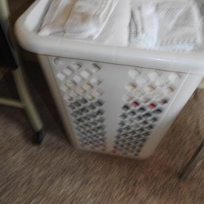 Laundry hamper full of towels