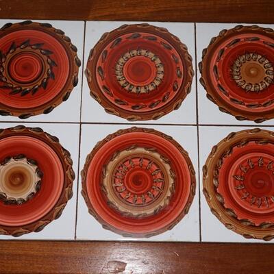 TEAK NESTING TABLE WITH HAND PAINTED ON TILE DESIGNS.