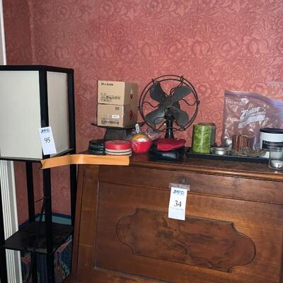 Floor lamp, candles and antique metal fan