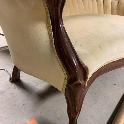 Antique sofa and matching arm chair.