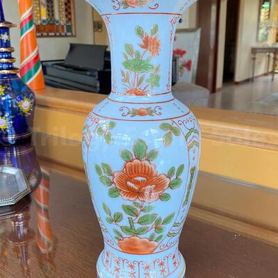 Blue Asian vase with orange flowers