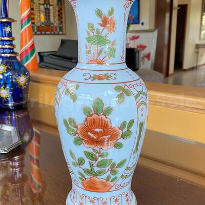 Blue Asian vase with orange flowers