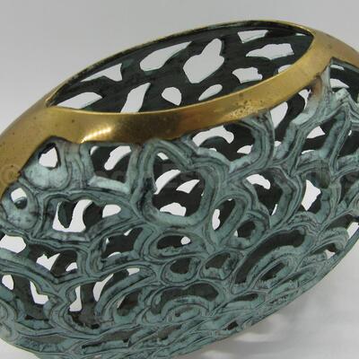 Brass filigree vessel with patina