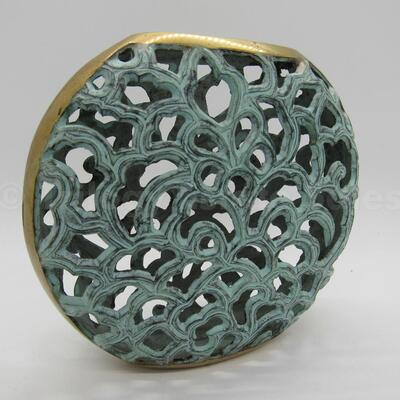 Brass filigree vessel with patina