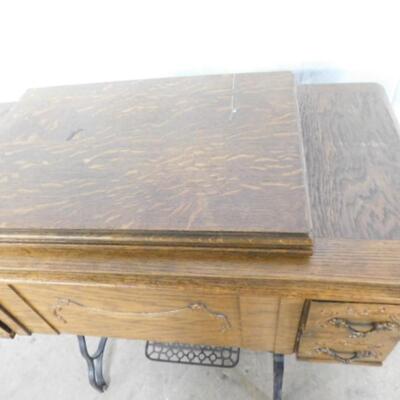 Antique Cast Body Defender Sewing Machine in Oak Cabinet with Foot Treadle