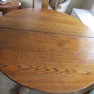 Antique Solid Oak Table on Casters with Four Single Slat Back Chairs