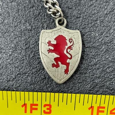 LION SHIELD NECKLACE W/ INSCRIPTION FROM â€œTHE CHRONICLES OF NARNIAâ€