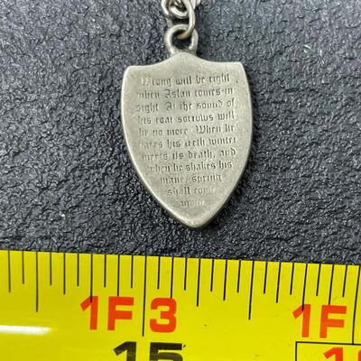 LION SHIELD NECKLACE W/ INSCRIPTION FROM â€œTHE CHRONICLES OF NARNIAâ€