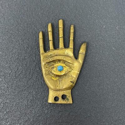 GOLD-TONED METAL HAND EYE FIGURINE
