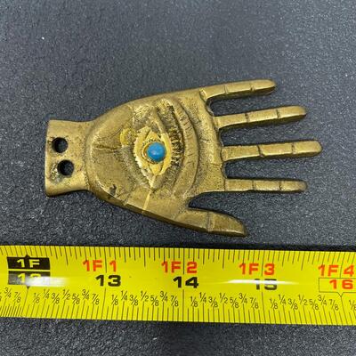 GOLD-TONED METAL HAND EYE FIGURINE