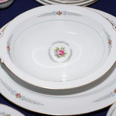 DInnerware service for eight. with serving pieces. Sweet little rose center.